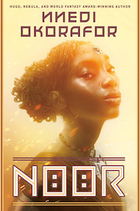 The entire cover is yellow/gold with a black women from the chest up facing towards the right but with her head turned slightly forward. The women has her hair up and arranged on the back of her head and is wearing what looks like a jewel on her forehead and a necklace. 