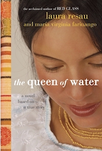 A head shot of a woman with light brown skin and black hair takes up most of the cover. She is looking downwards with her eyes mostly closed. She is wearing a gold neckless with four strands of beads and a white dress. The authors names and the title are over her face. The left edge of the cover has a cloth pattern in green and reds.