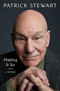 A head shot of Sir Patrick Stewart takes up most of the cover with his chin resting on his clasped hands. He's wearing a black suit jacket with a green shirt under it. 