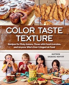 Color Taste Texture book cover. The top third of the book has a picture of cinnamon rolls on the right and chicken figures on the right. The middle contains the title and author's name on a brown textured background. The bottom third is a group of four children setting behind a table filled with all kinds of different foods either eating or drinking the food.